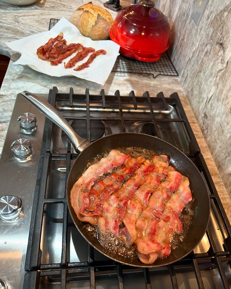 Bacon frying in a skillet